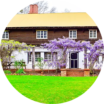 Fairbridge Village's large accommodation house is surrounded by vibrant outdoor plants