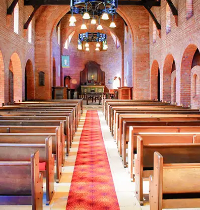 Interior view of Fairbridge Village chapel made of red bricks, perfect for wedding occasions