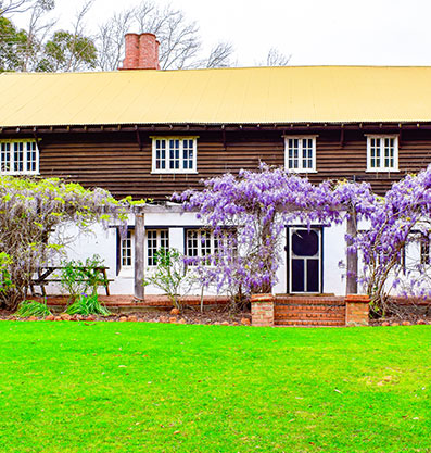 Fairbridge Village's large accommodation house is surrounded by vibrant outdoor plants