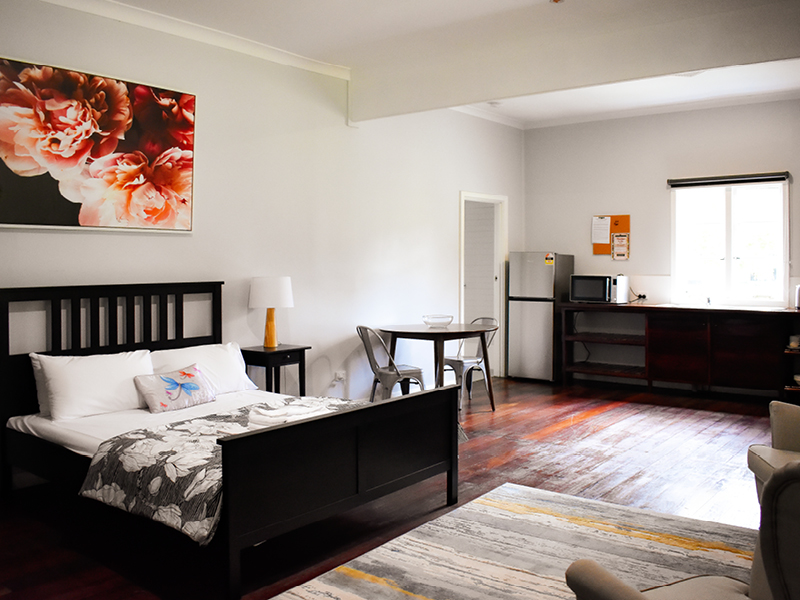 Elegant bedroom in black and white accent theme of Lawley Cottage in the south west accommodation at Fairbridge Village