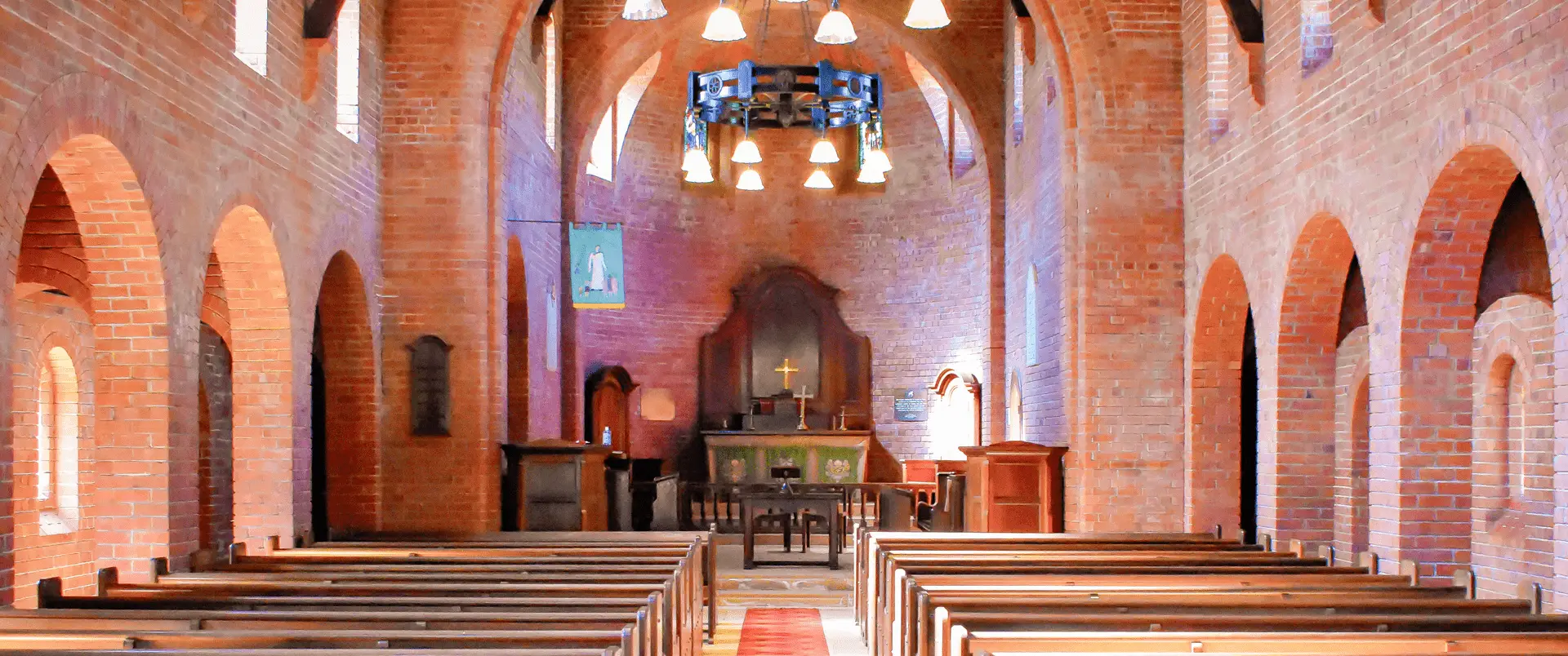 Interior view of Fairbridge Village chapel made of red bricks, perfect for wedding occasions